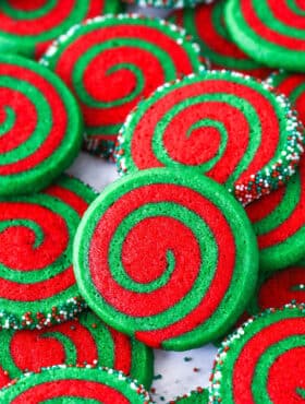 A pile of Christmas pinwheel cookies on a plate