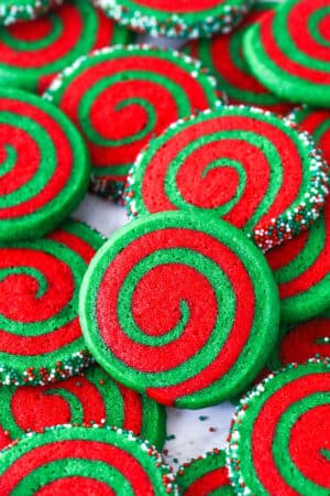 A pile of Christmas pinwheel cookies on a plate