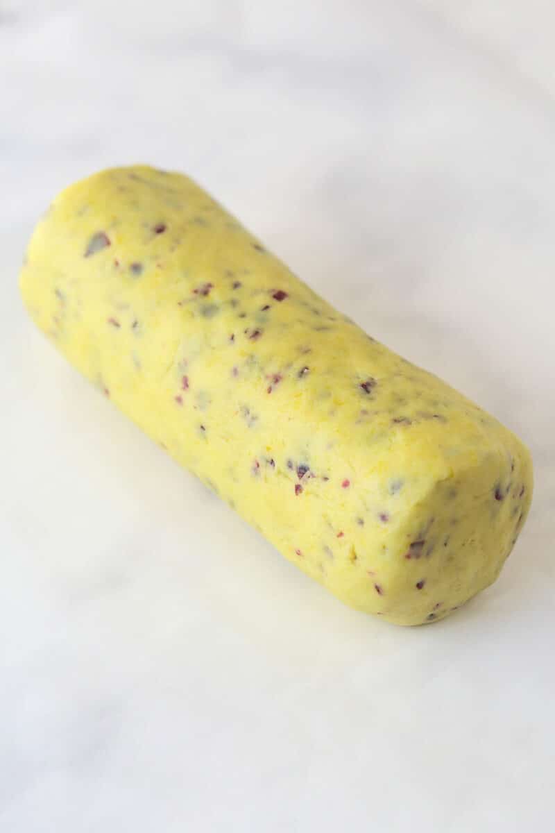 A log of cranberry orange shortbread cookie dough