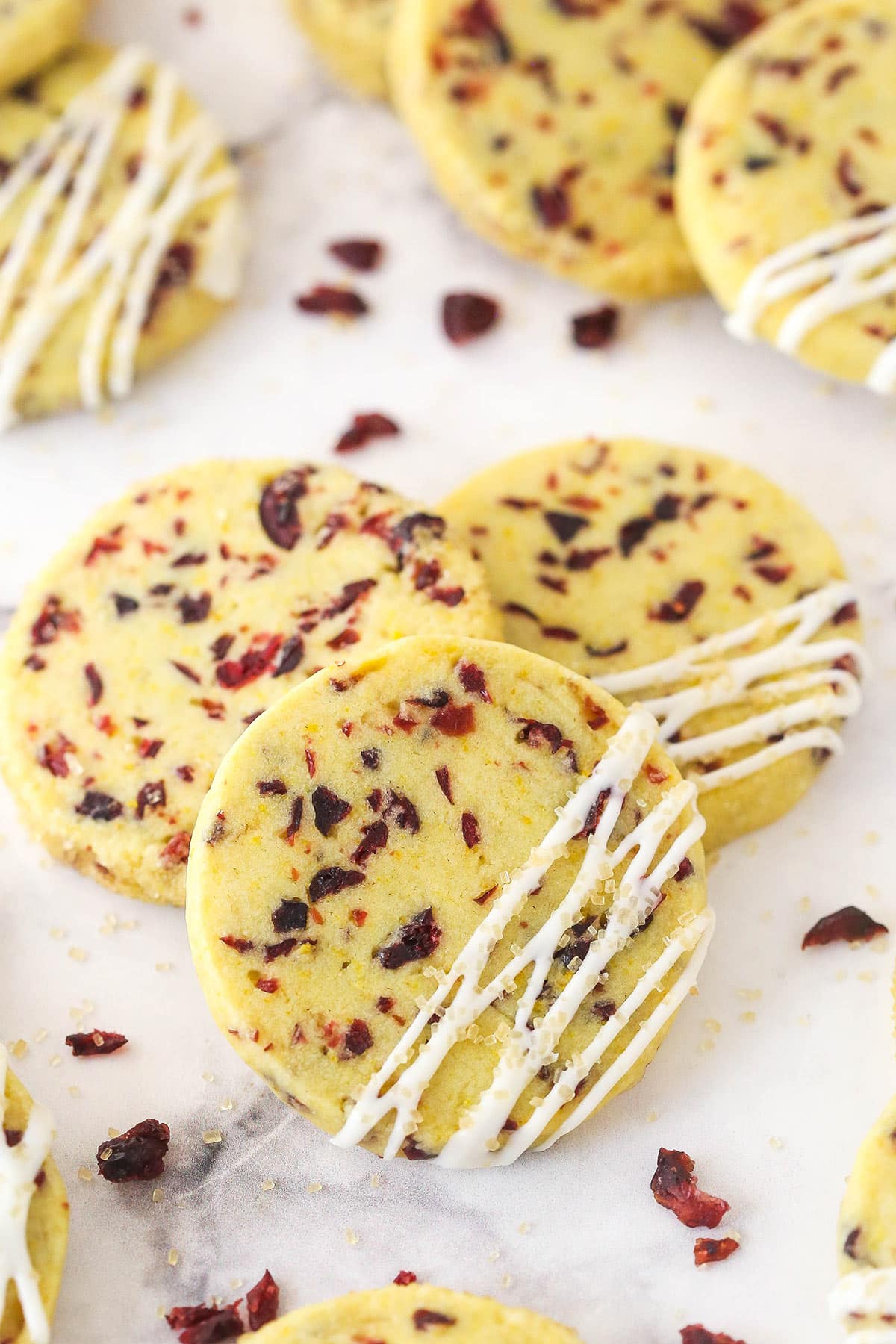 Overhead view of cranberry orange shortbread against a white background