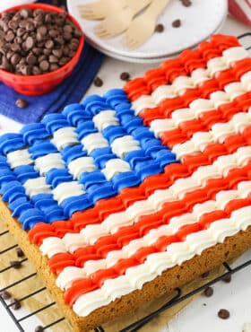 A full Flag Chocolate Chip Cookie Cake on a cooling rack