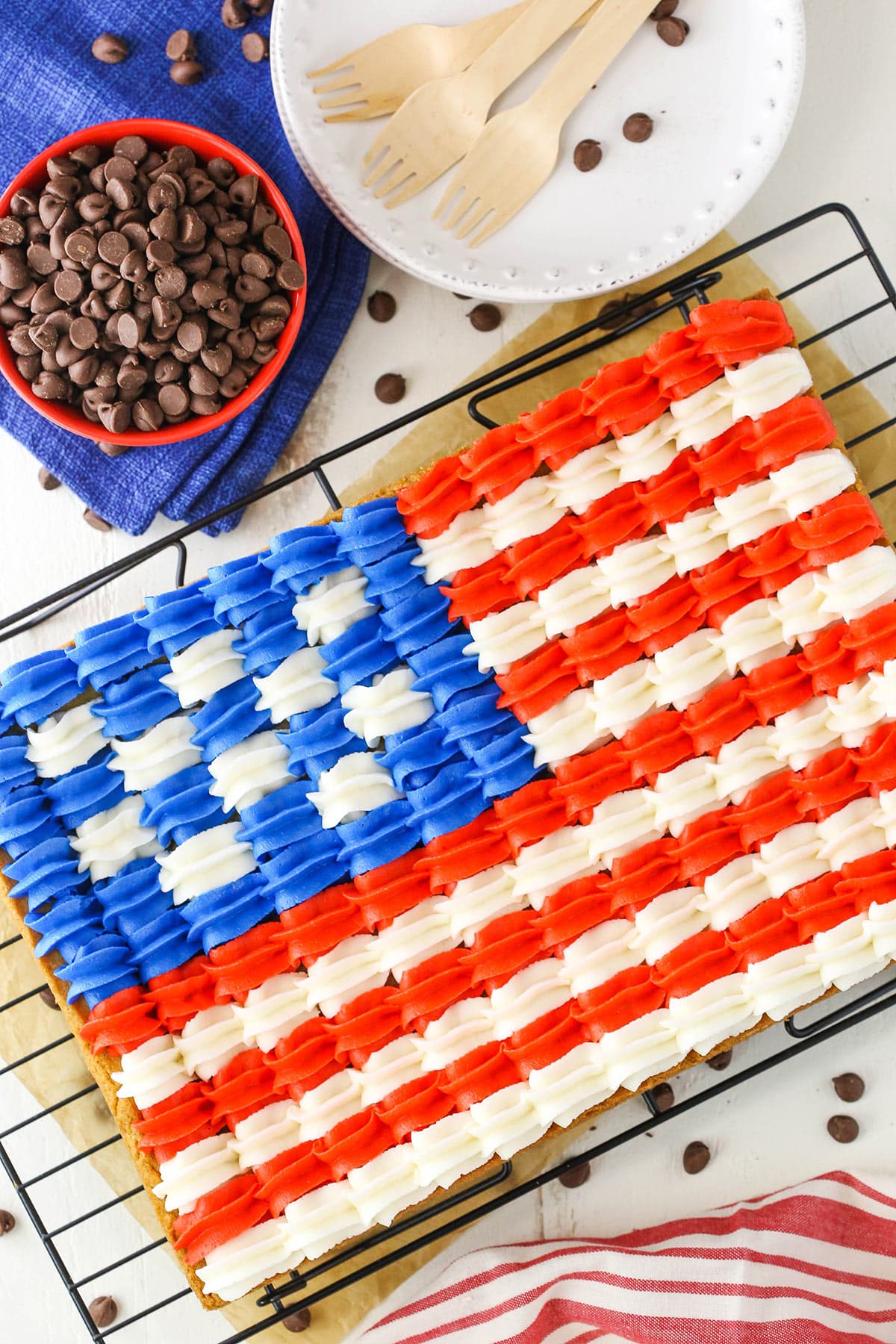 Overhead view of a full Flag Chocolate Chip Cookie Cake on a cooling rack