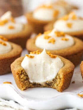 Close up of a Gingerbread Cheesecake Cookie Cup with a bite removed to show interior.