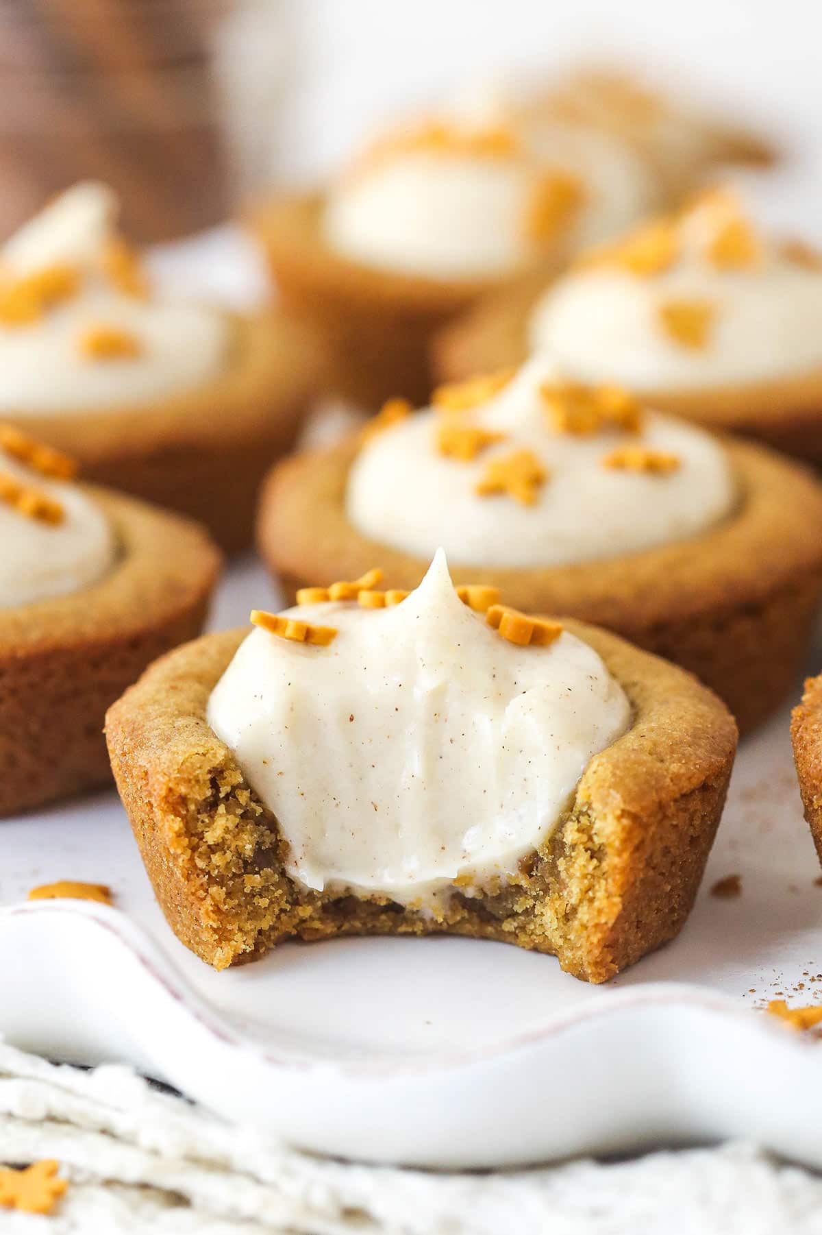 Close up of a Gingerbread Cheesecake Cookie Cup with a bite removed to show interior.