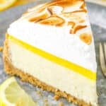 A slice of Lemon Meringue Cheesecake on a gray plate