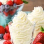 Mascarpone whipped cream in a clear glass bowl