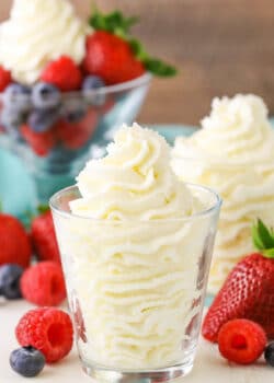 Mascarpone whipped cream in a clear glass bowl