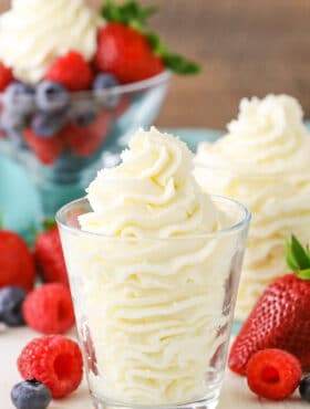 Mascarpone whipped cream in a clear glass bowl