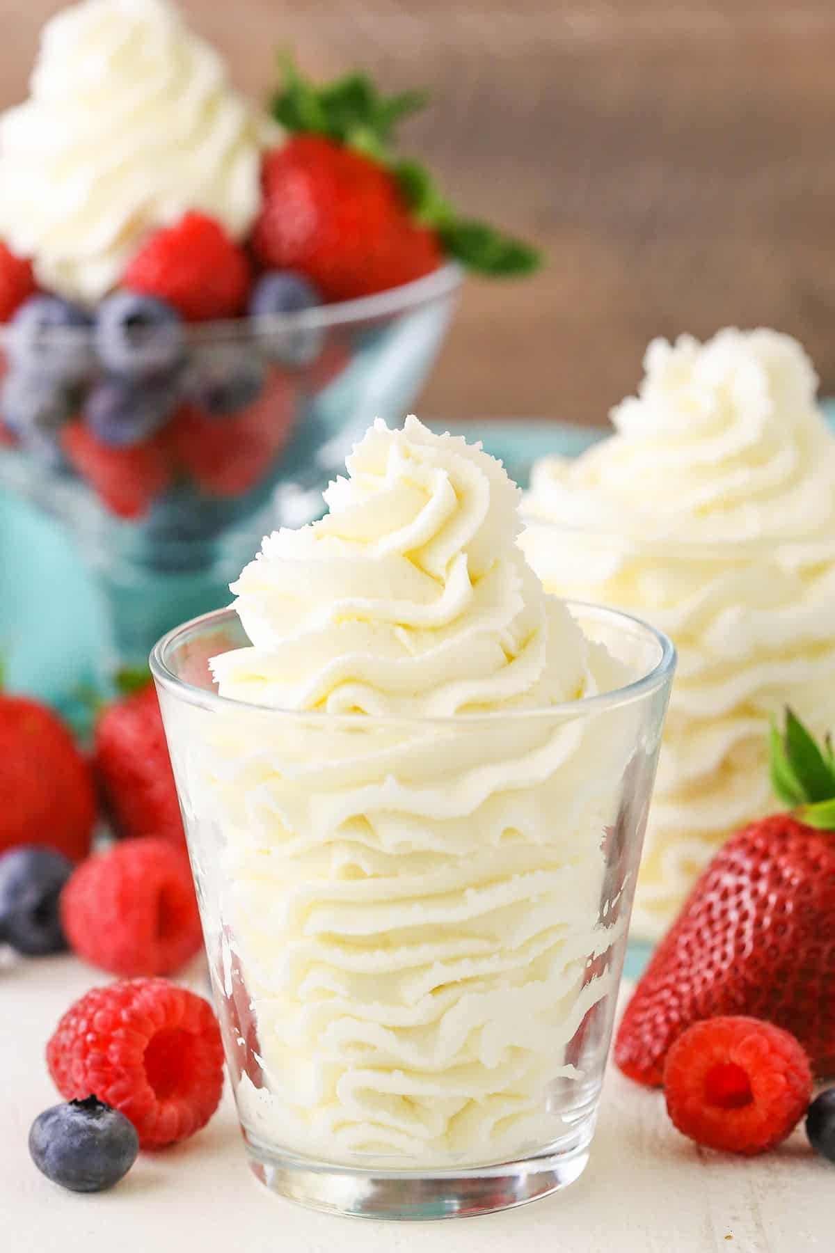 Mascarpone whipped cream in a clear glass bowl