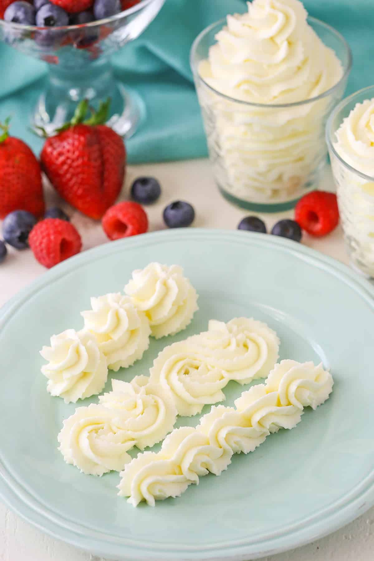 Mascarpone whipped cream swirls on a blue plate