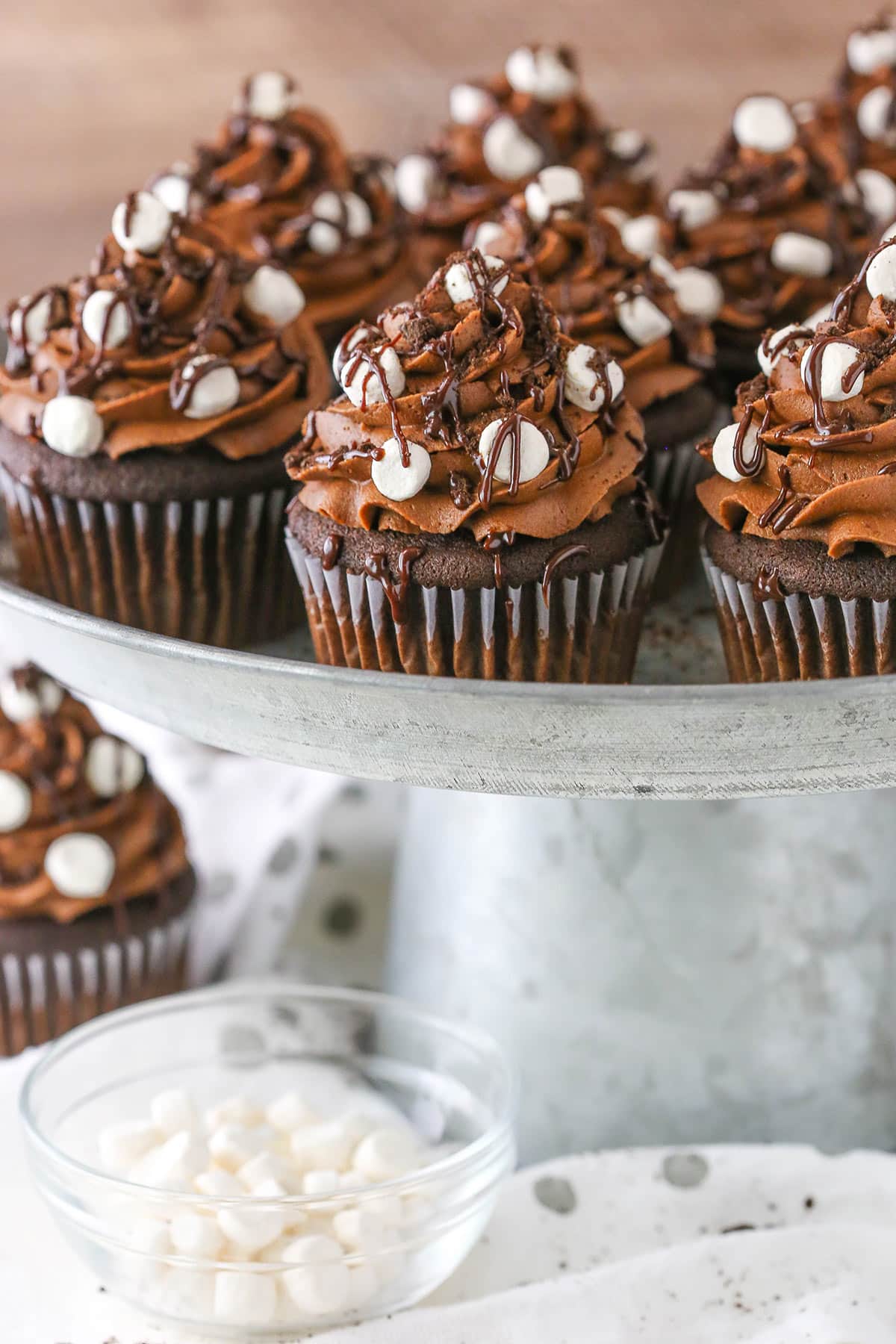 Mississippi Mud Cupcakes placed on a gray cake stand