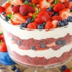 A full Red Velvet Berry Trifle in a clear glass trifle bowl