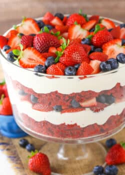 A full Red Velvet Berry Trifle in a clear glass trifle bowl