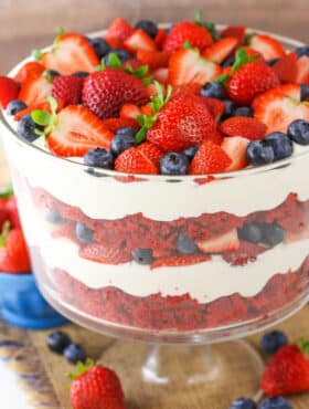 A full Red Velvet Berry Trifle in a clear glass trifle bowl