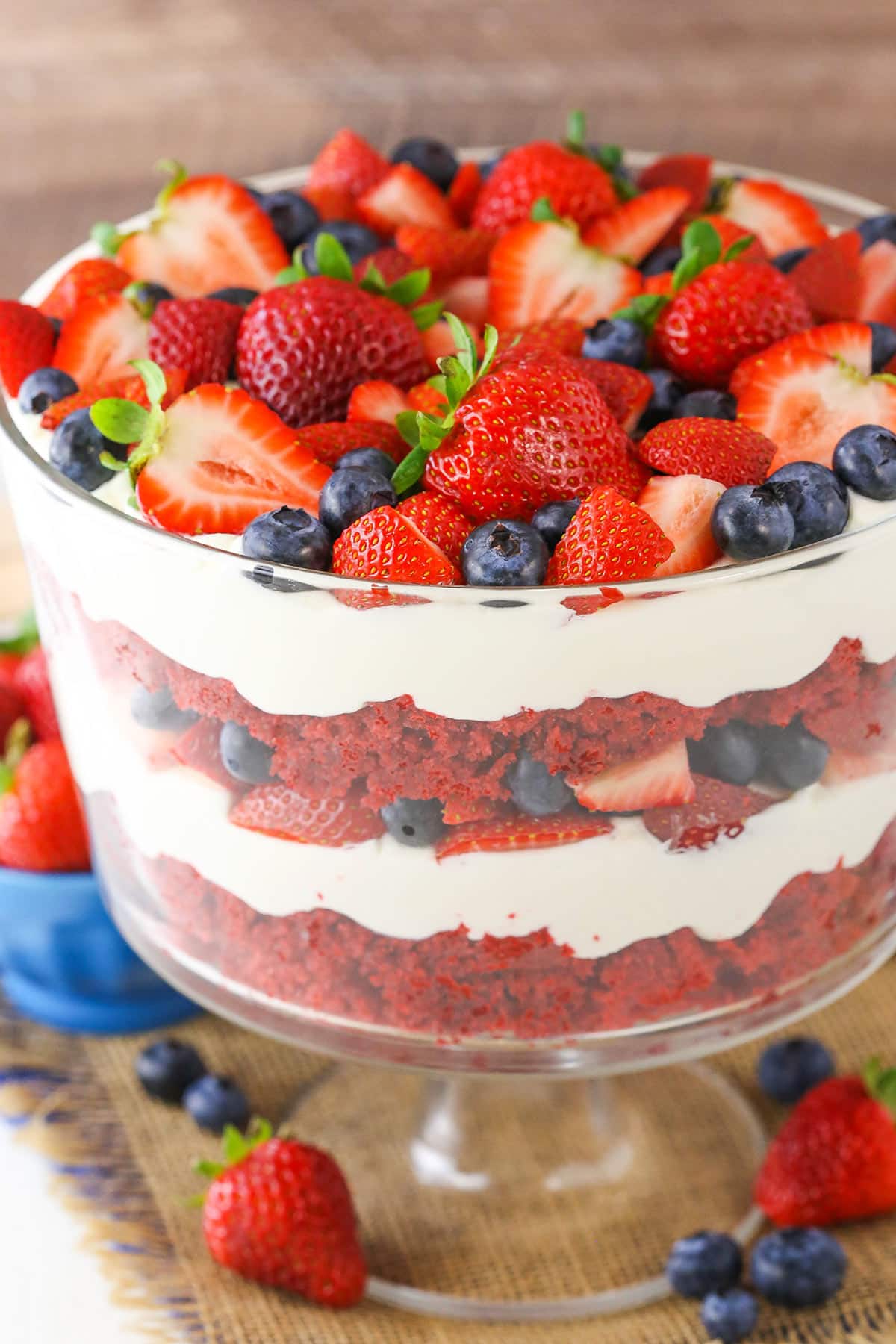 A full Red Velvet Berry Trifle in a clear glass trifle bowl