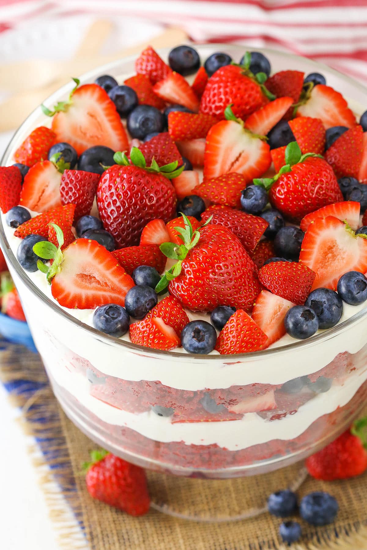 Overhead view of a full Red Velvet Berry Trifle in a clear glass trifle bowl