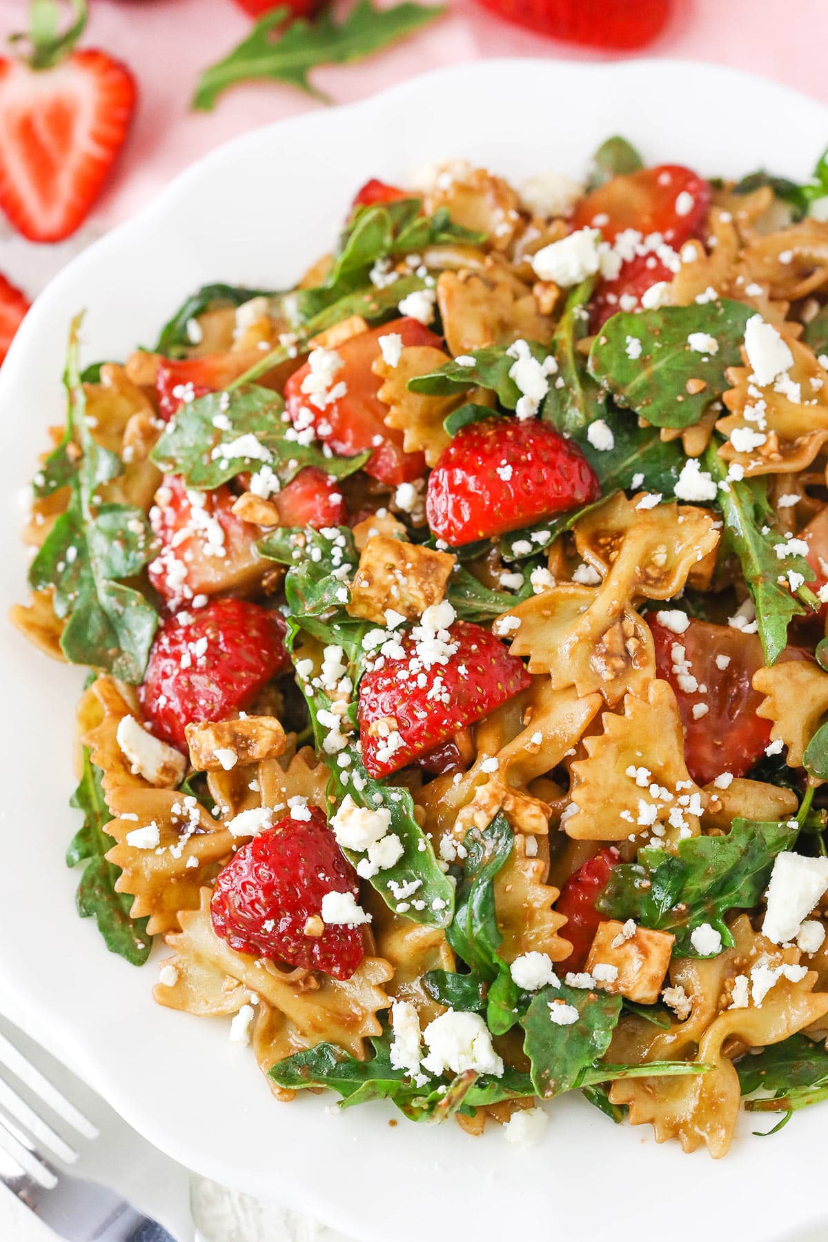 Overhead view of Strawberry Feta Balsamic Pasta Salad on a white plate