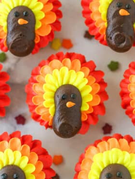 close up of turkey cupcakes on marble countertop