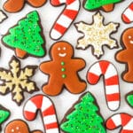 overhead view of chocolate cut out cookies decorated for Christmas