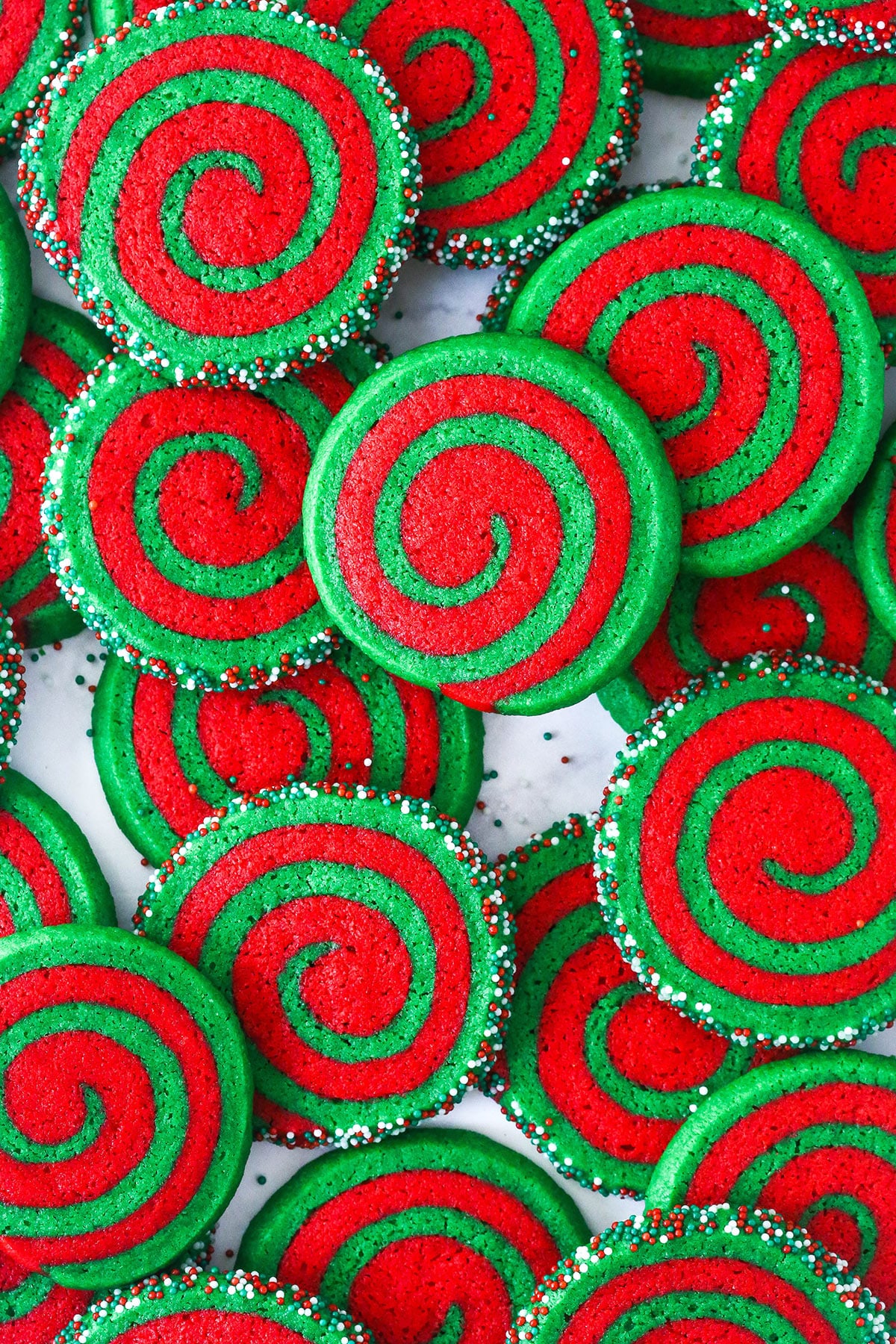 A pile of Christmas pinwheel cookies on a the counter