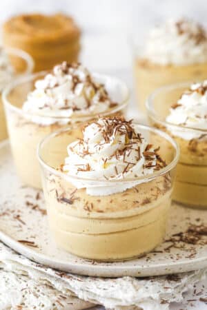 Glasses of peanut butter mousse topped with whipped cream