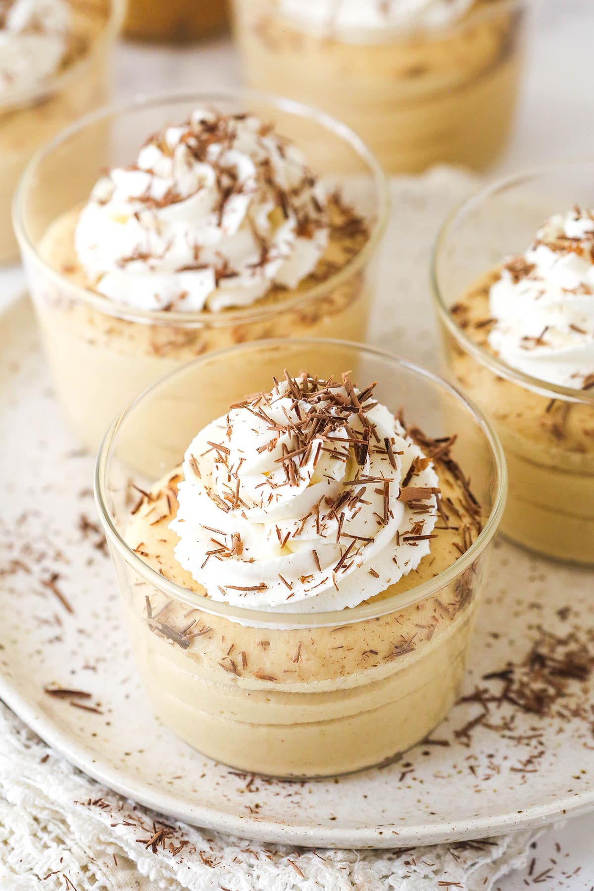 Glass cups of peanut butter mousse with whipped cream