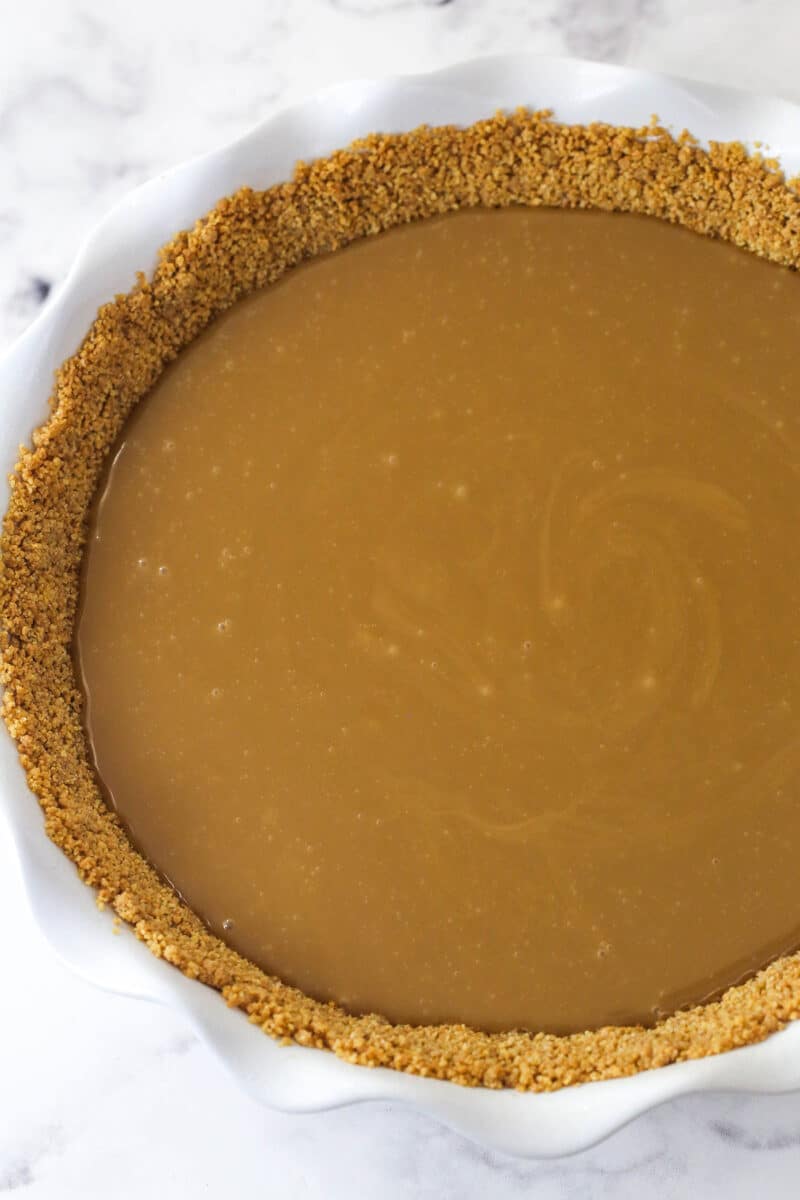 Toffee filling added to graham cracker pie crust