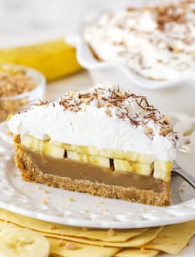 A slice of banoffee pie on a white plate