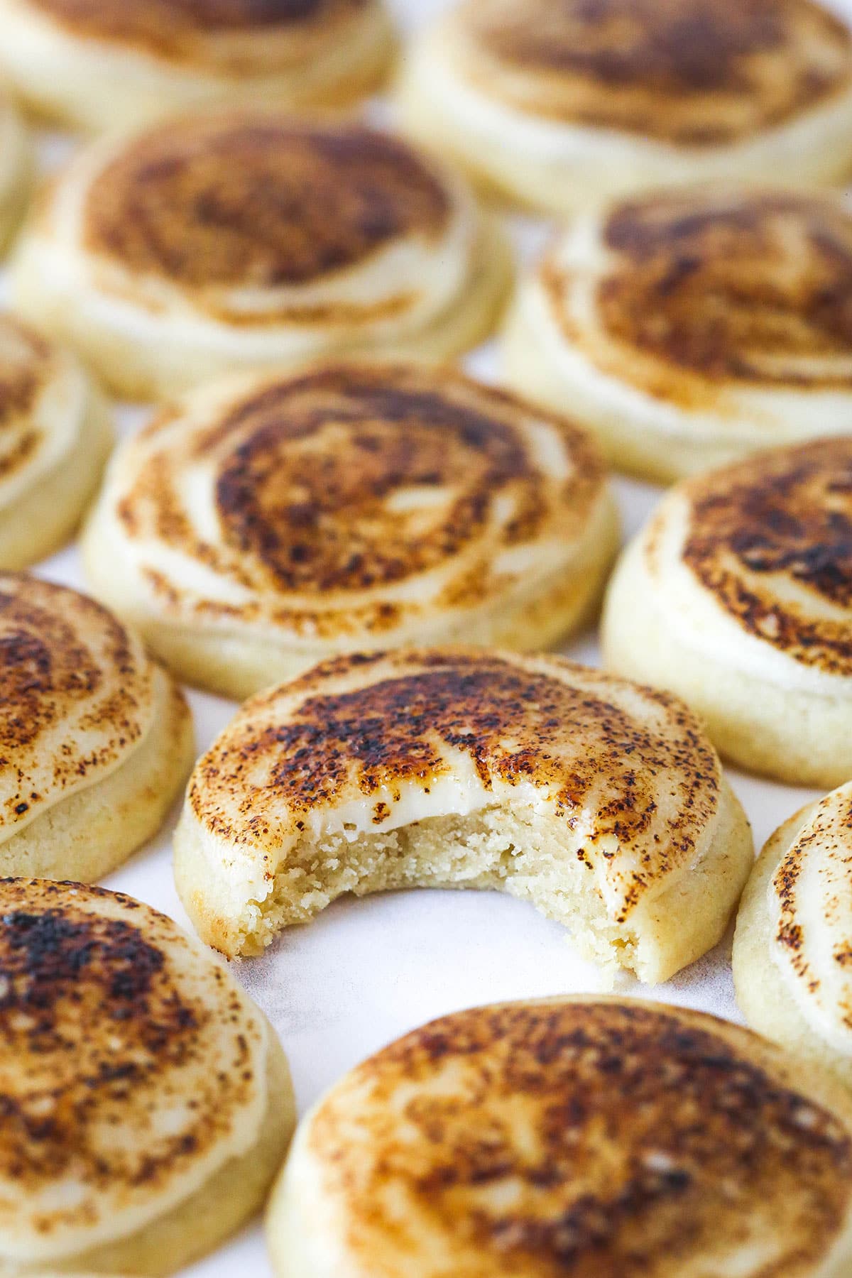 Creme brulee cookies, one with with a bite missing