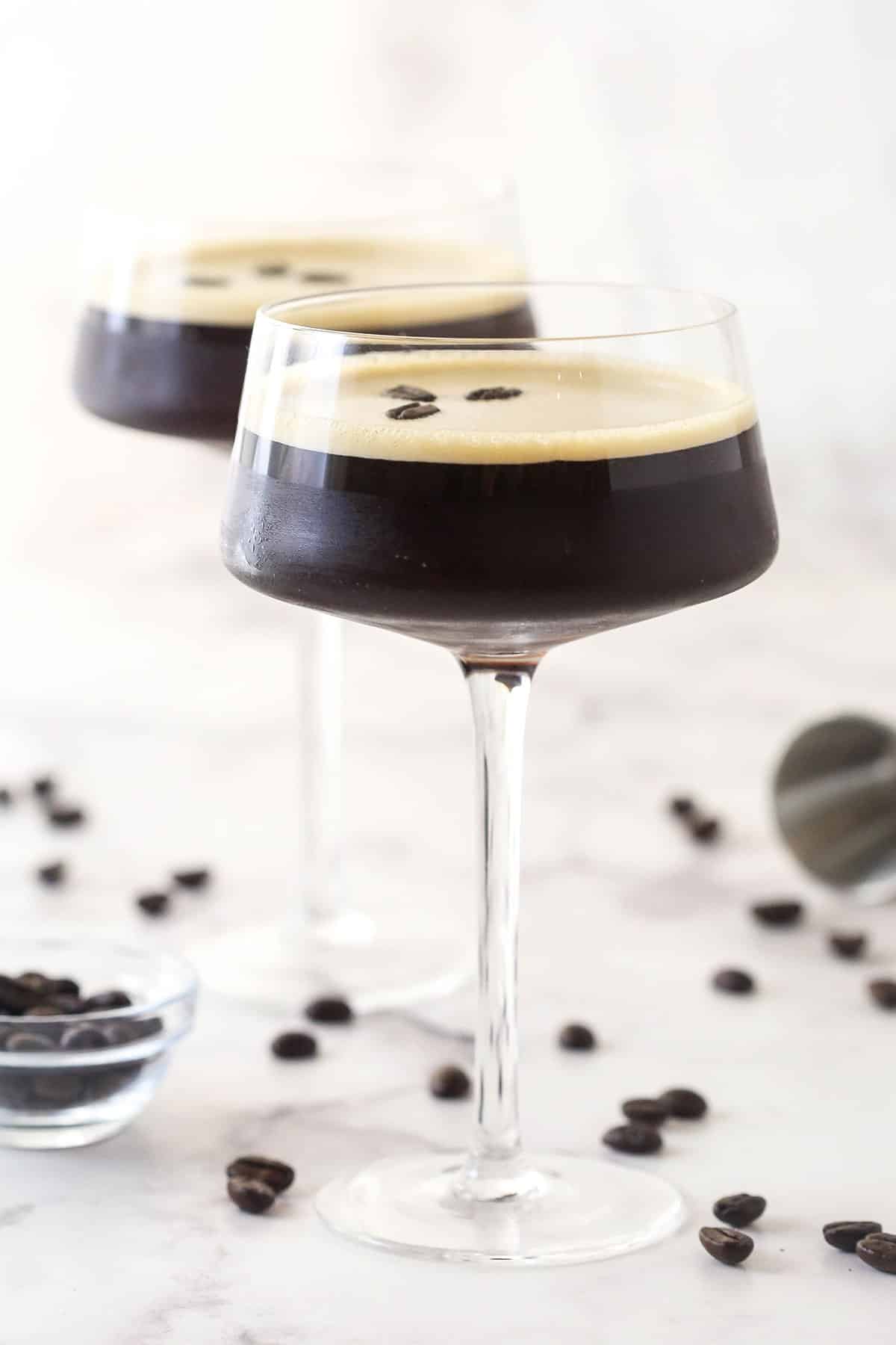 Two espresso martinis in martini glasses