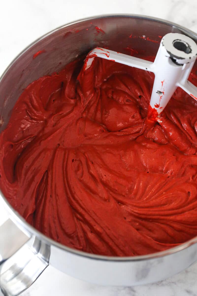 Red velvet cake batter in a mixing bowl