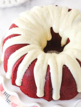 Overhead view of a red velvet bundt cake with cream cheese icing