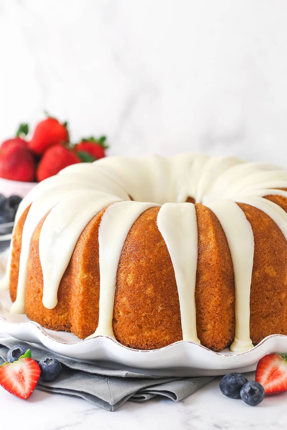 A vanilla bundt cake topped with vanilla icing