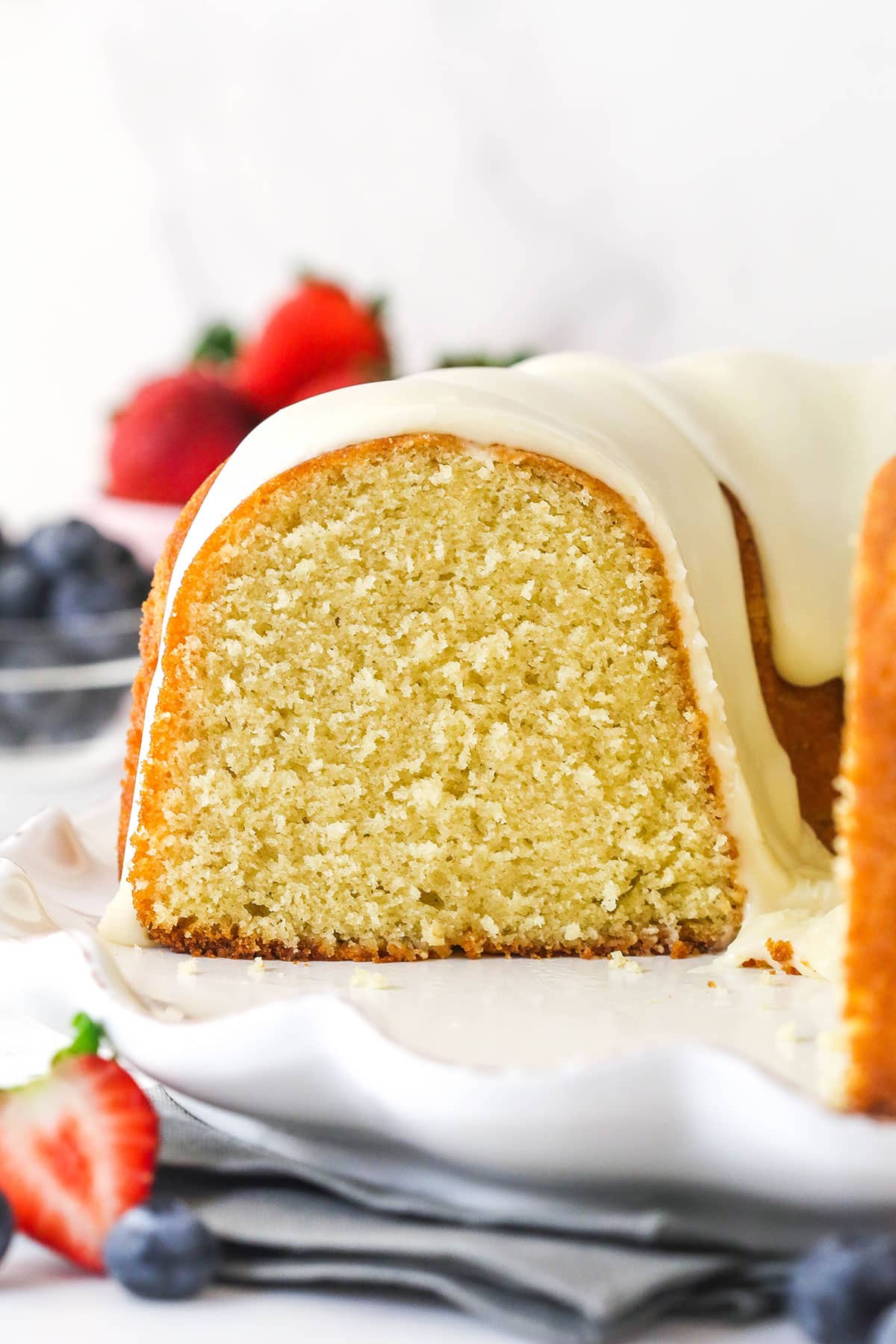 Vanilla bundt cake with a slice removed to show the inside