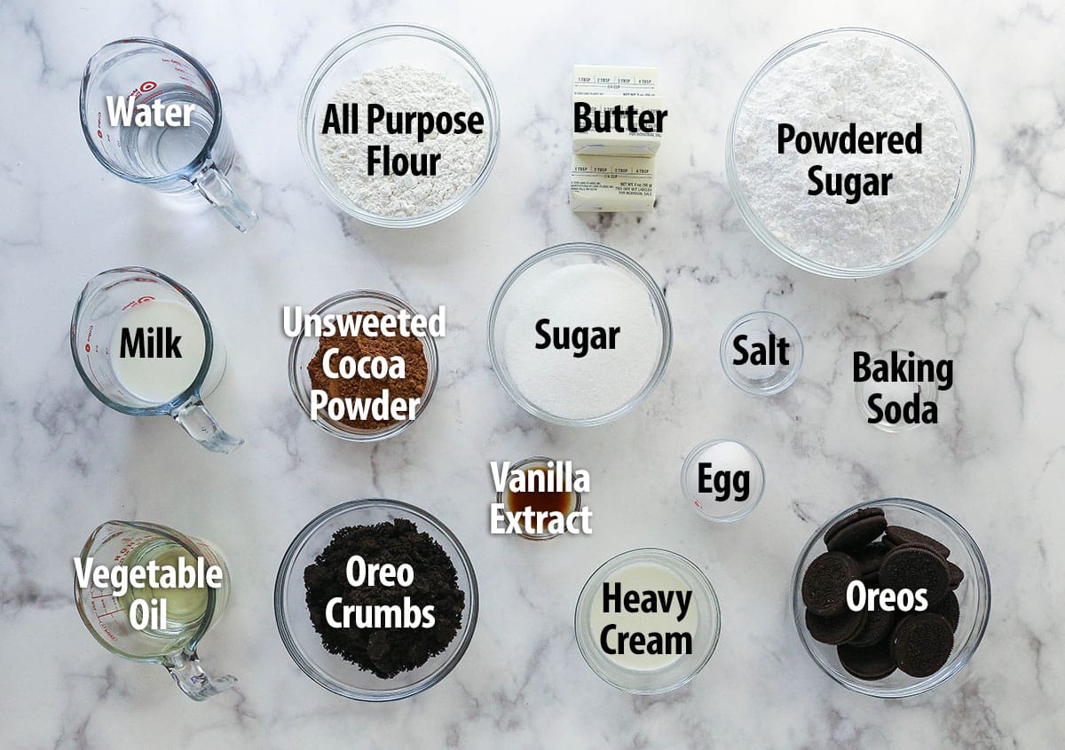 Labeled ingredients for Oreo cupcakes spread out on a work surface.