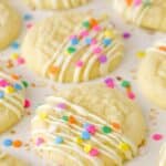 Decorated Coconut Sugar Cookies drying on parchment paper.